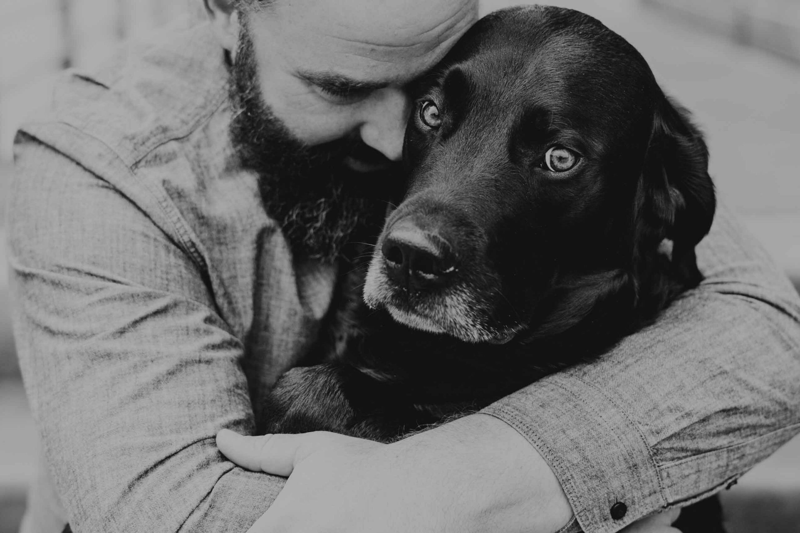 man and dog black and white